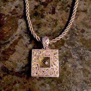 Cookie Lee Silver tone pendant w/green stone and green cord.